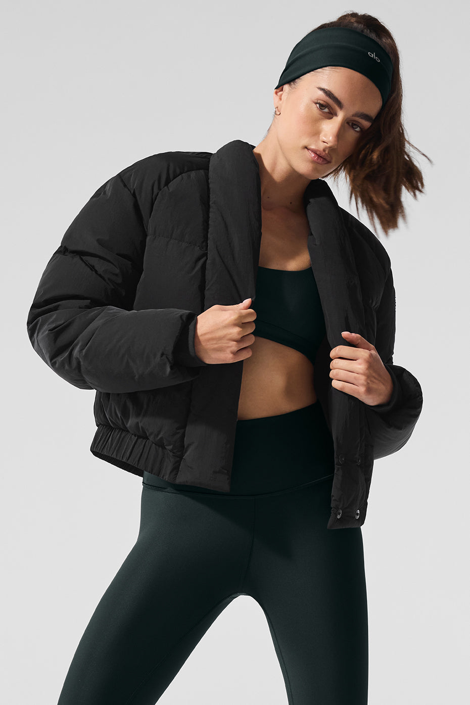 Front view of the black puffer jacket showcasing its chic design