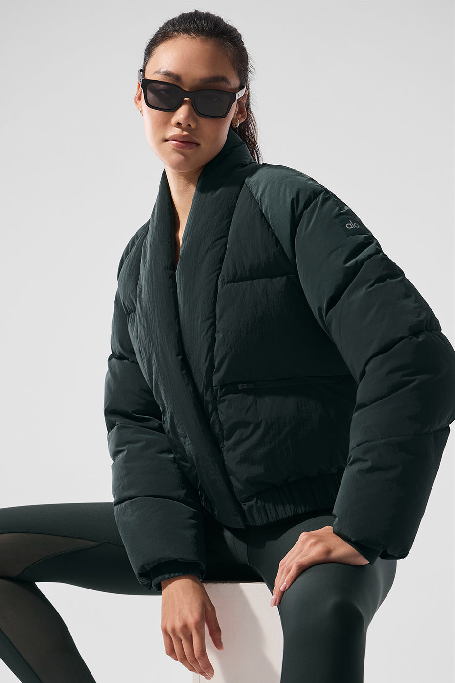 Side view showcasing the zippered pockets of the puffer jacket