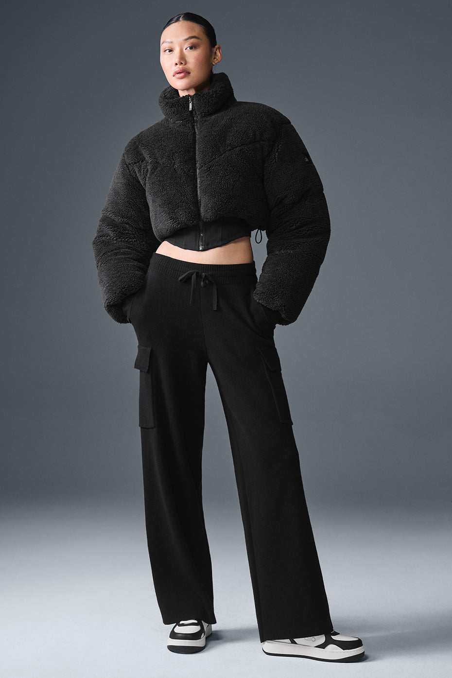 Close-up of sherpa fabric texture and structured puffer silhouette