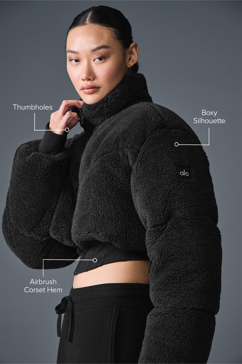 Model wearing womens winter jacket with hood, walking snowy NYC streets