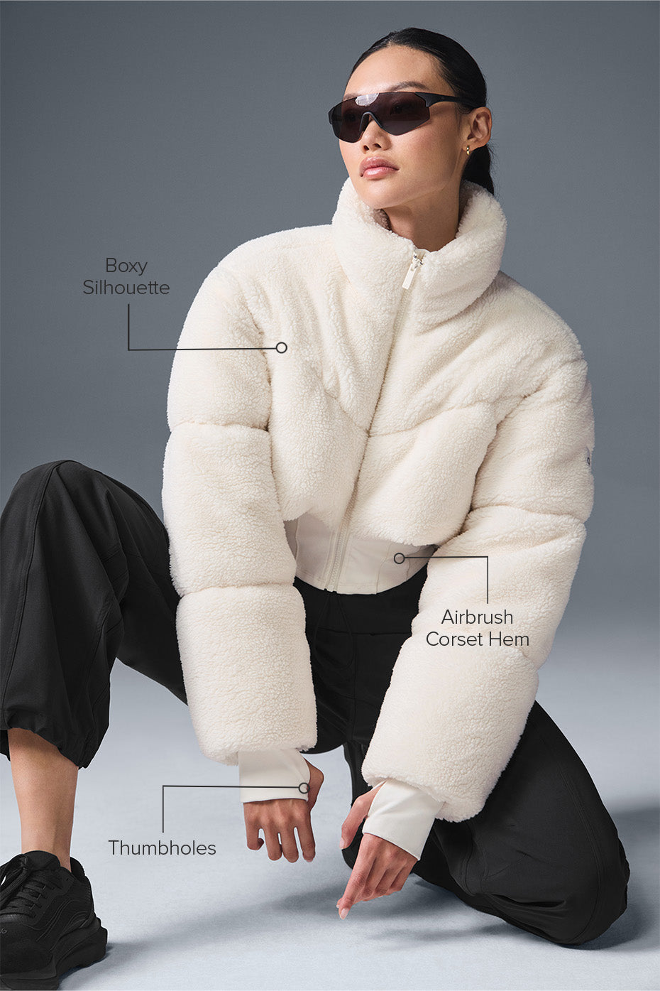 Close-up of the corset hem detail on the sherpa coat.