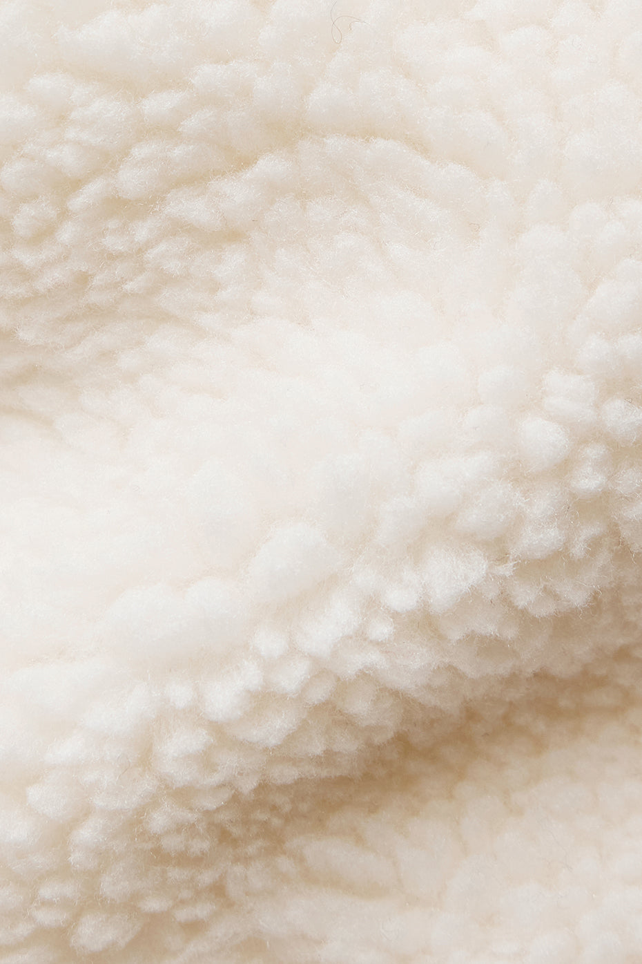 Close-up of the corset hem detail on the sherpa coat.
