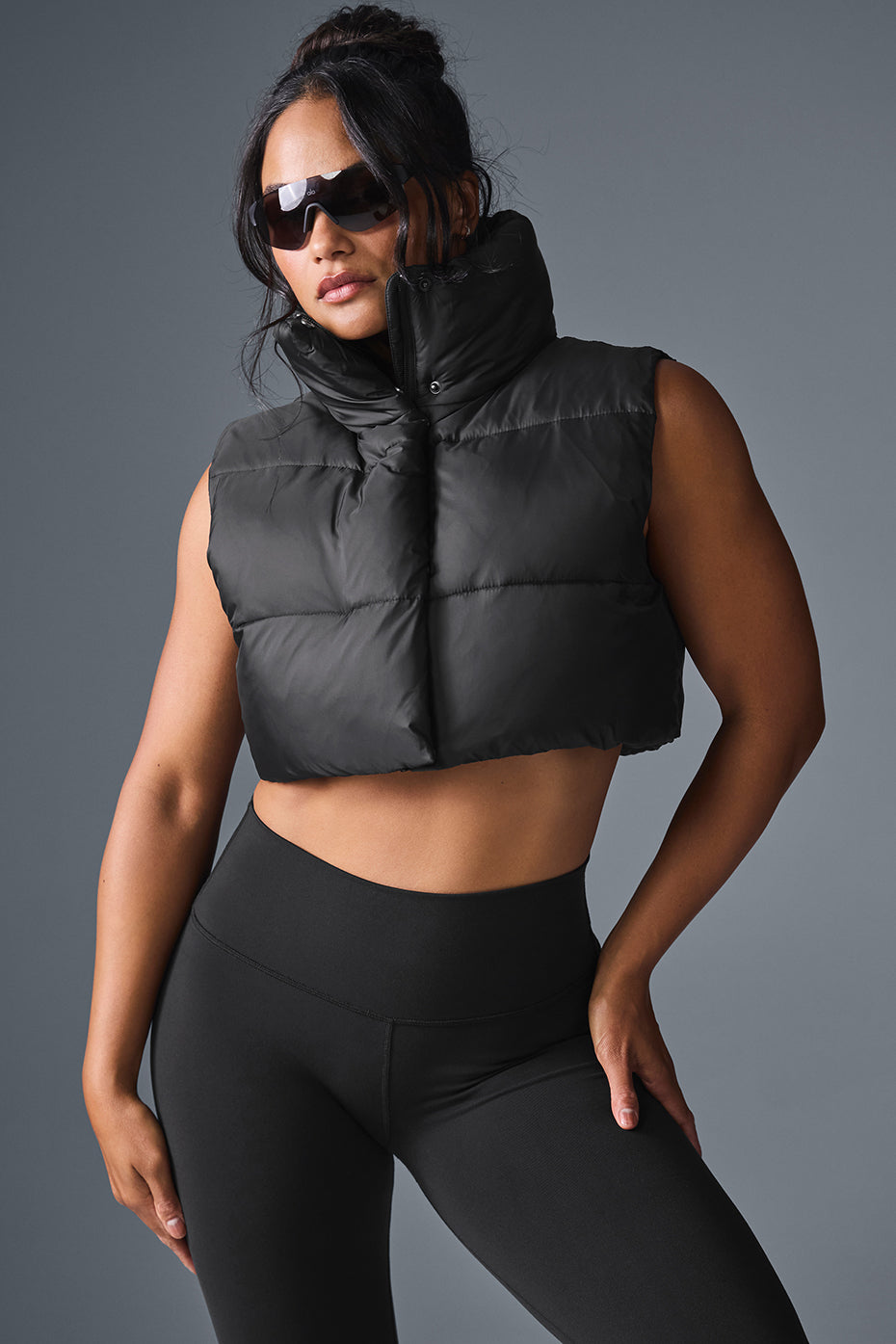 Front-facing view of cropped vest paired with joggers and sneakers
