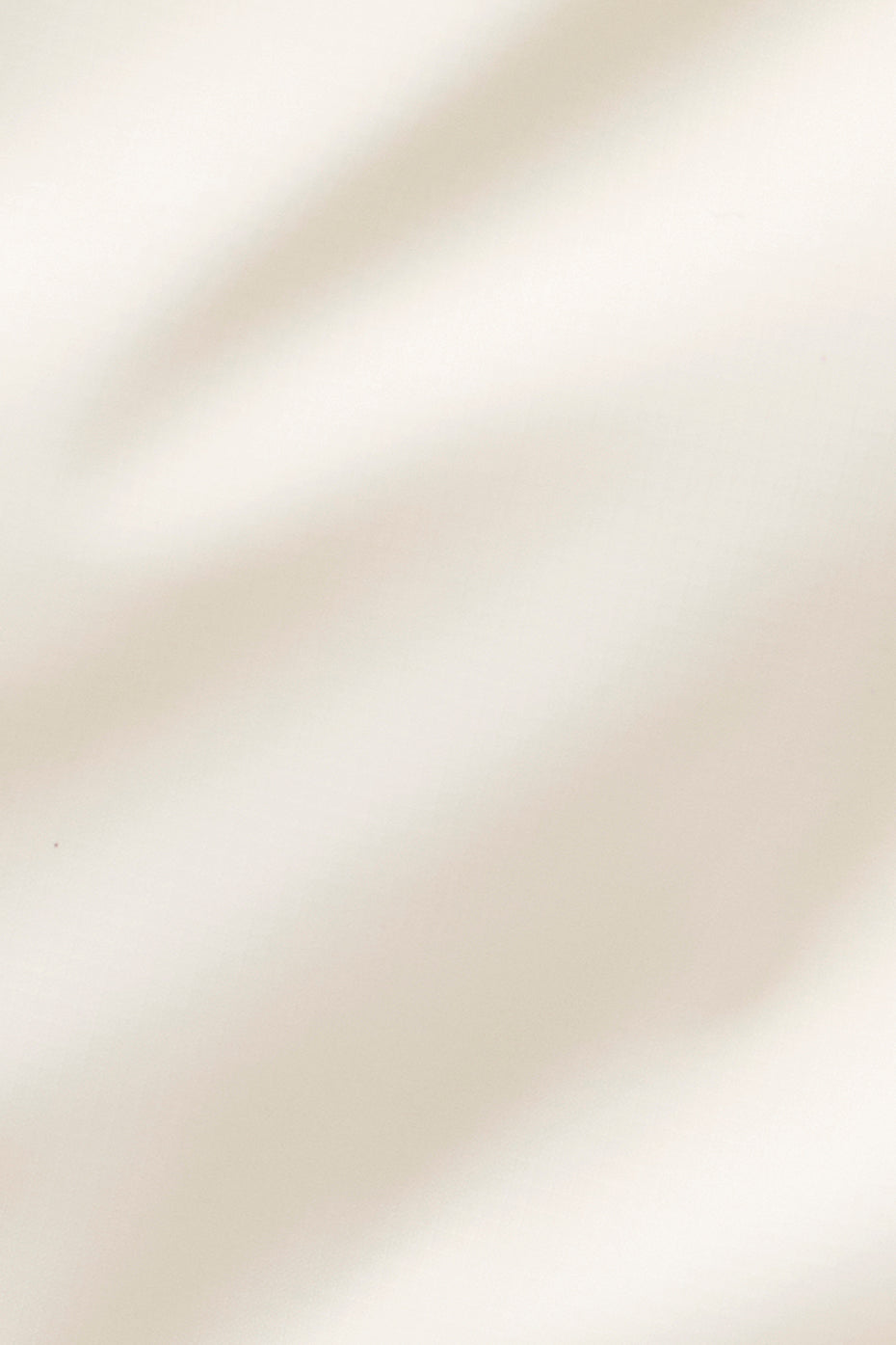 Close-up of the lightweight fabric of the cropped vest.