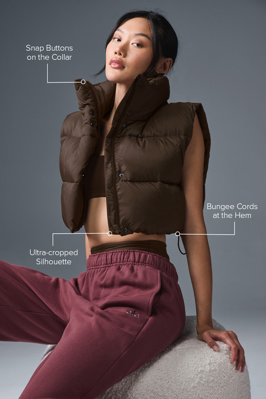 Model wearing the cropped vest during a coffee date.