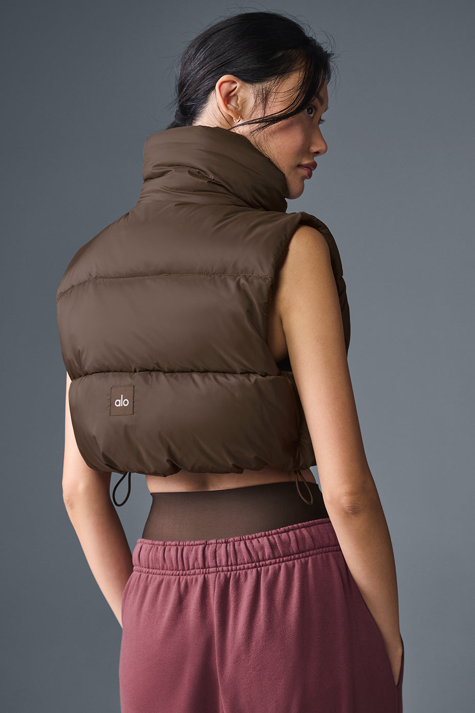 Close-up of the lightweight fabric of the cropped puffer vest.