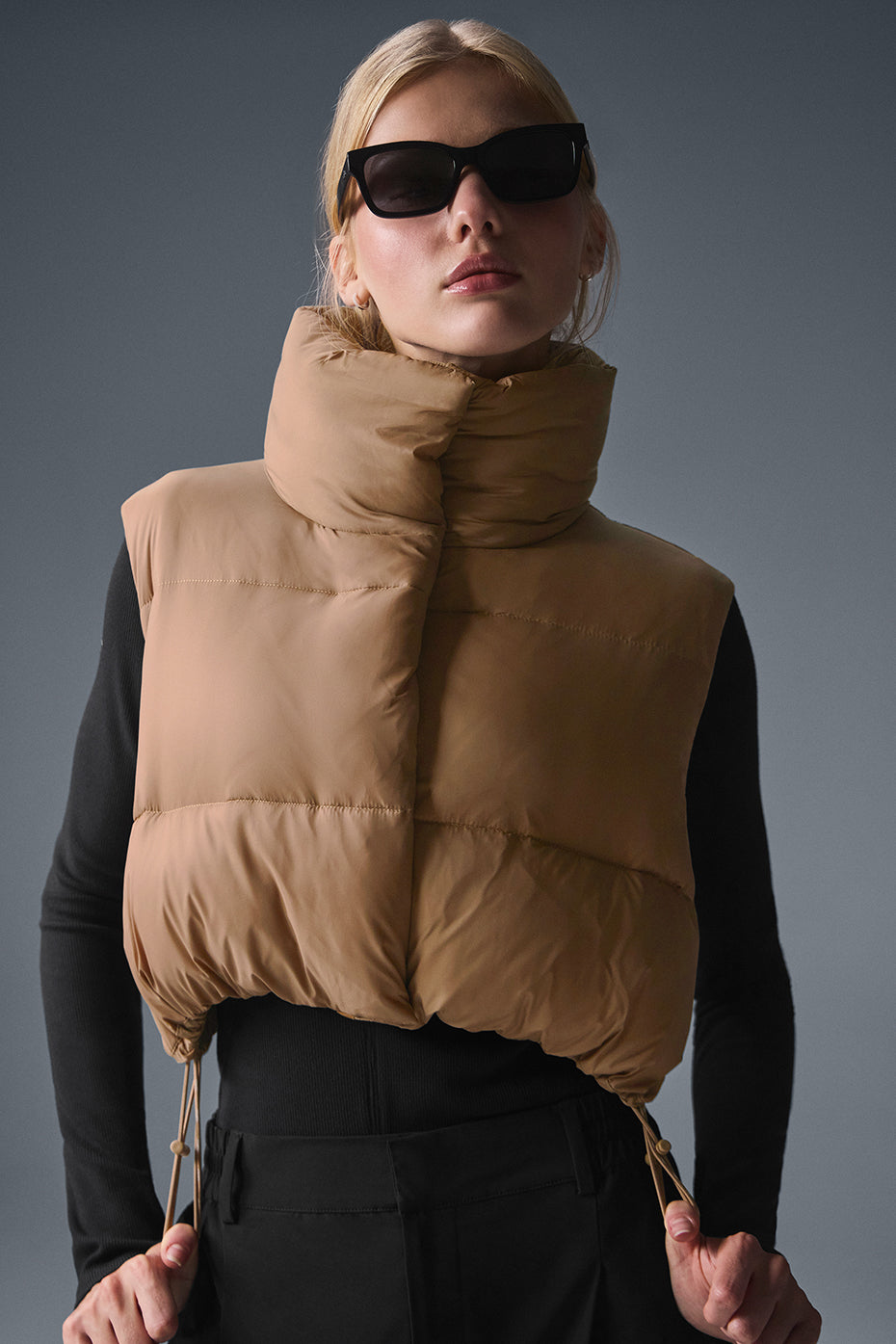 Model wearing the cropped vest during a morning workout.