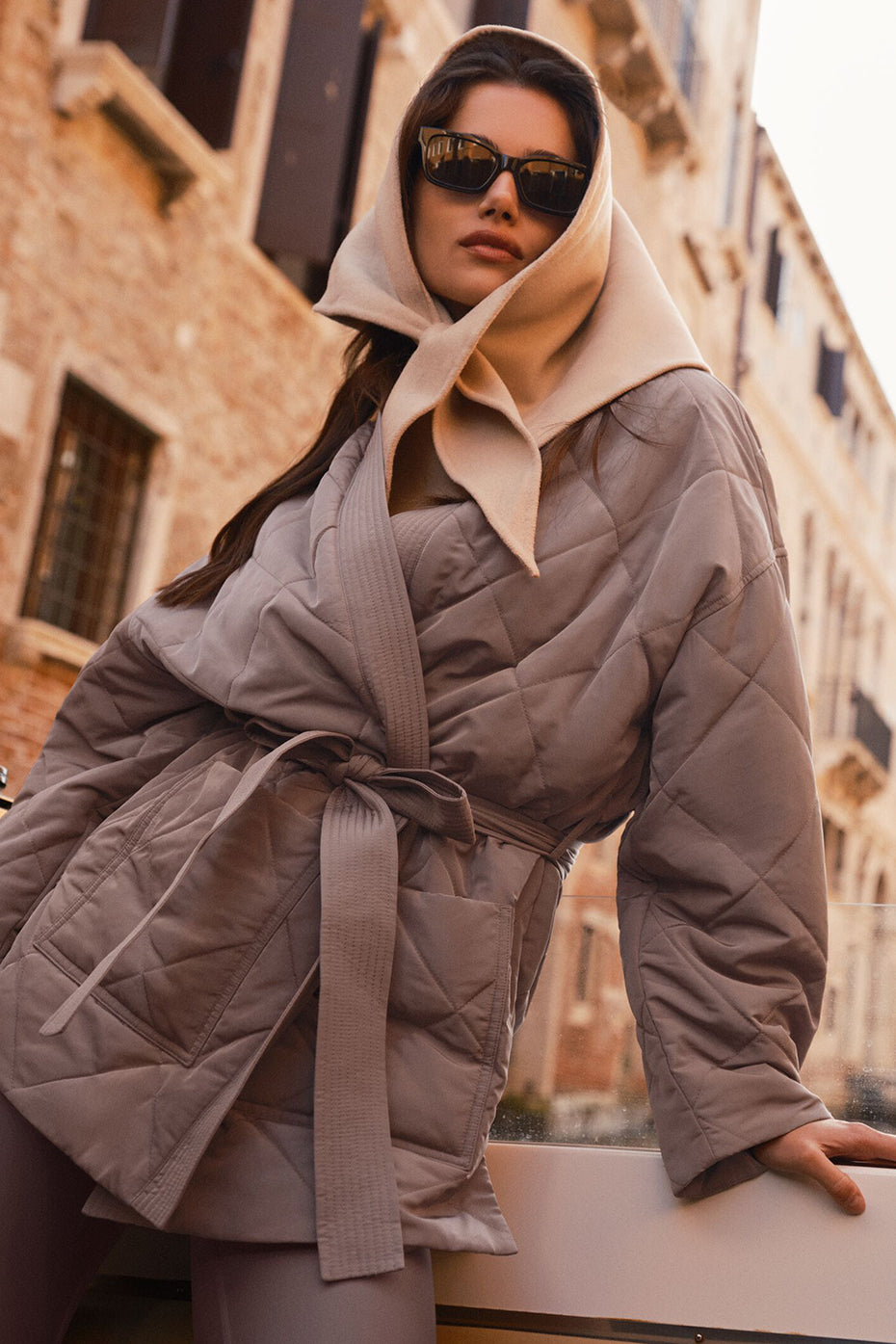 Close-up of the quilted stitching and wrap design on the puffer jacket