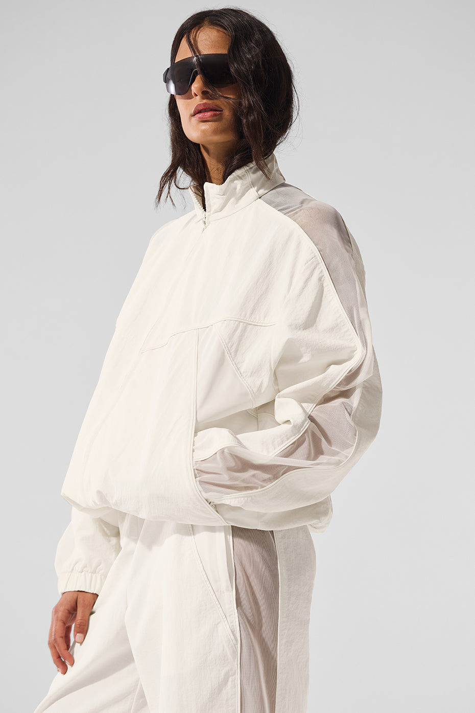 Street-style look: Origin jacket paired with black activewear dress