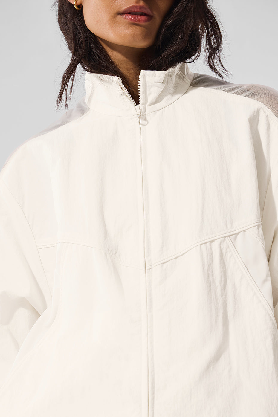 Close-up of mesh paneling and piping on jacket track design
