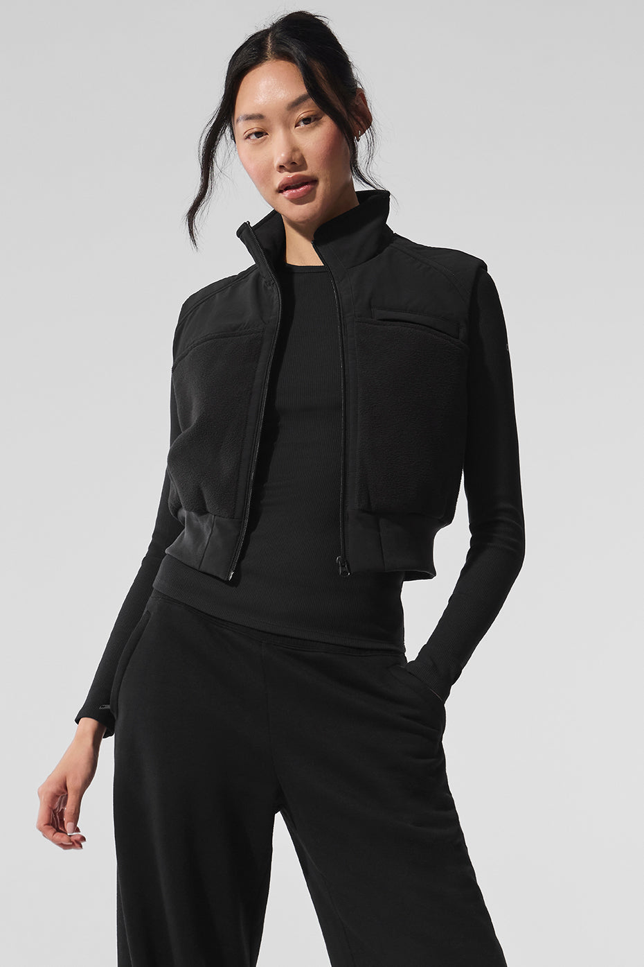 Men’s Columbia fleece vest in black, styled casually for winter