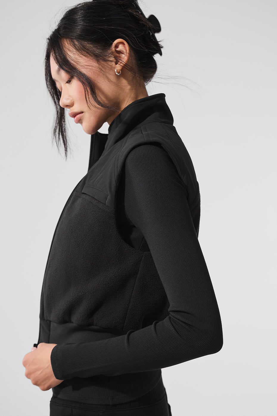 Men’s Columbia fleece vest in black, styled casually for winter
