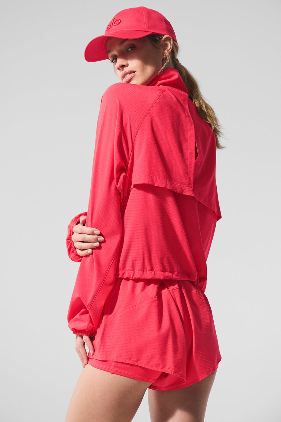 Front view of Sport Star lightweight zip up jacket in candy red, showcasing its sporty design.