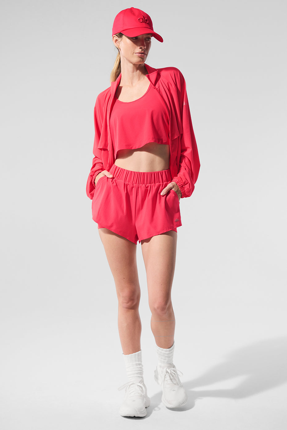 Side view of the zip up jacket paired with shorts, perfect for casual outings.