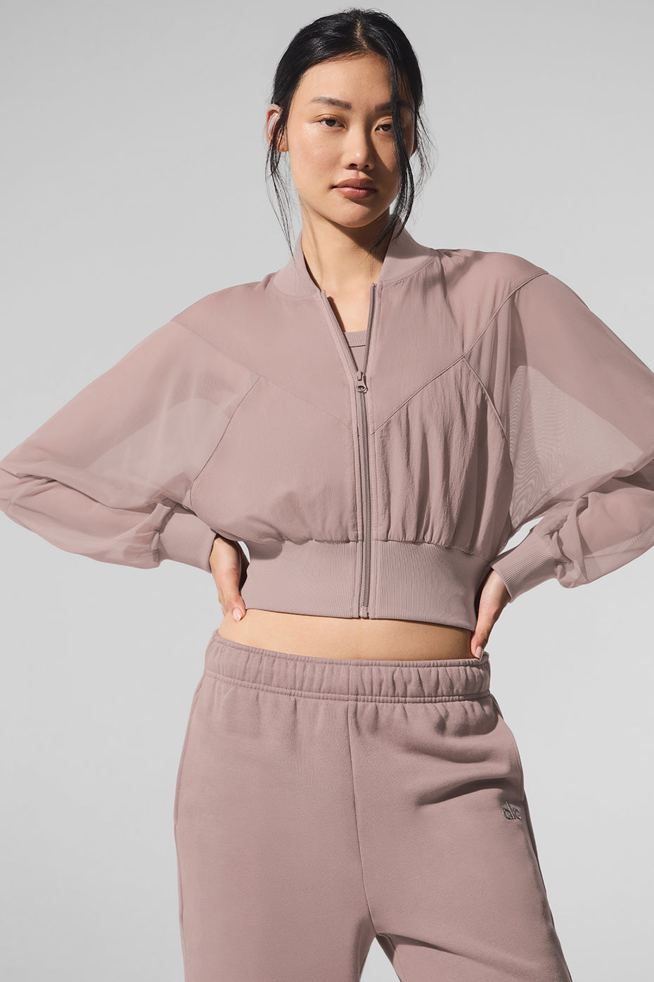 Front view of taupe cropped bomber jacket with mesh panels