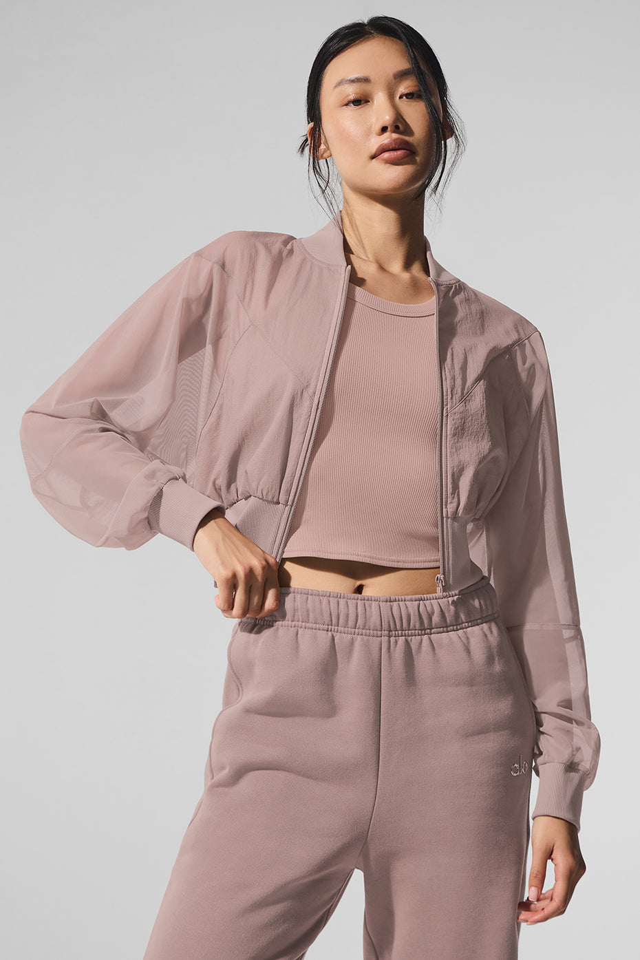 Front view of taupe cropped bomber jacket with mesh panels