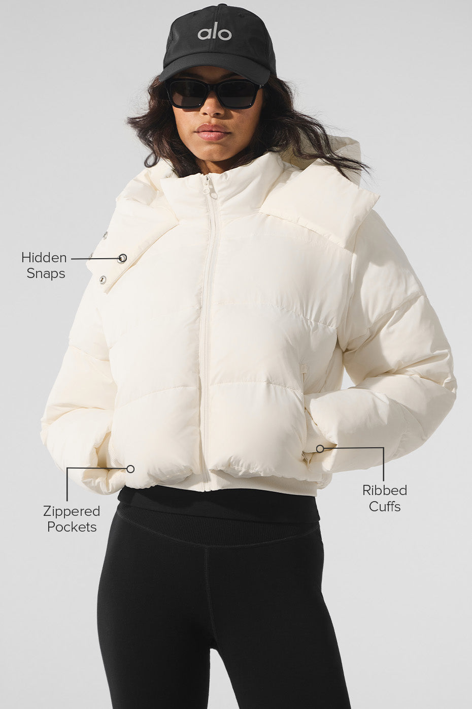 Close-up of ivory puffer jacket zipper and quilted detailing