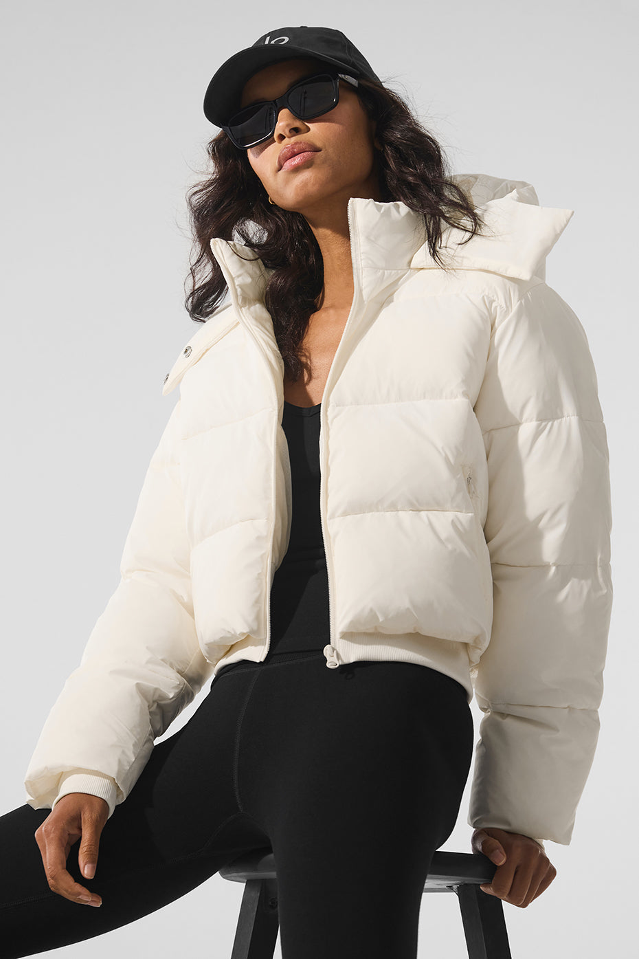 Columbia puffer jacket women's model wearing it with jeans and boots