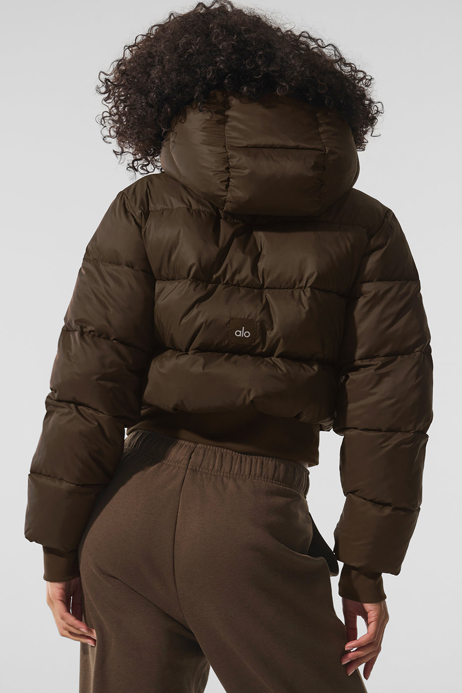 Full view of the Foxy Puffer Jacket displayed on a hanger, showcasing its stylish silhouette