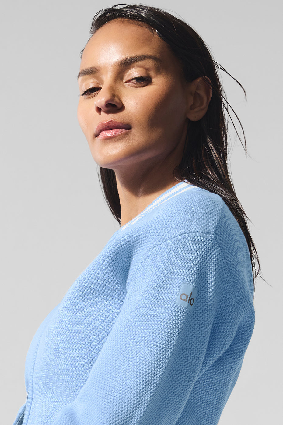 Seashell blue tennis club jacket worn on court