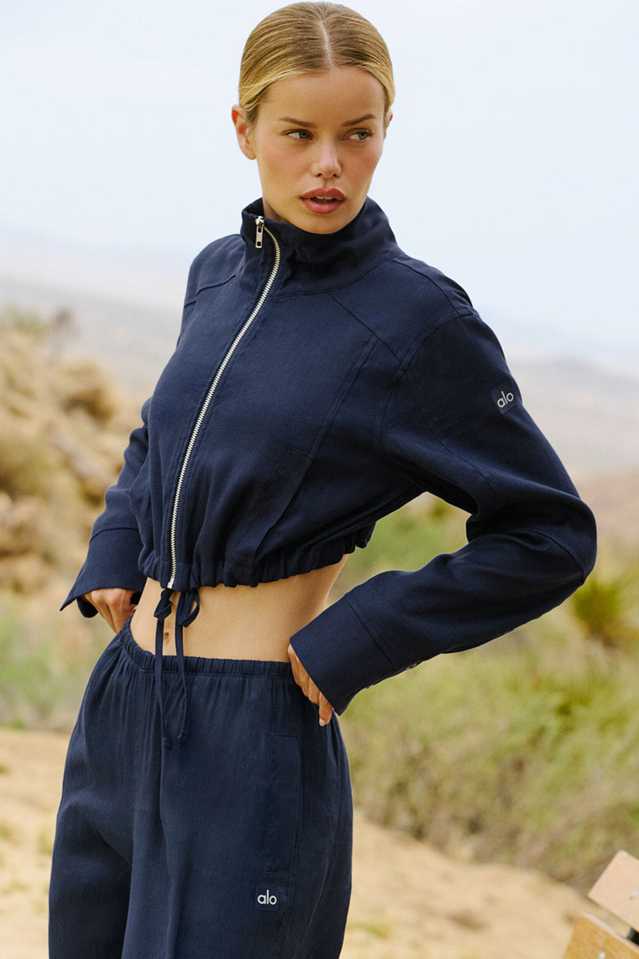 Front view of the navy linen cropped getaway jacket, ideal for summer outings.