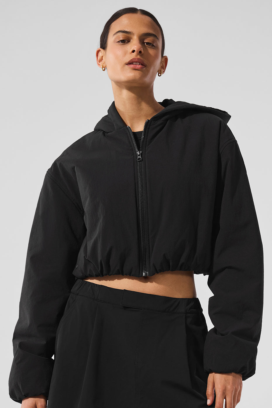 Close-up of the interior fleece lining of the black zip up hoodie.