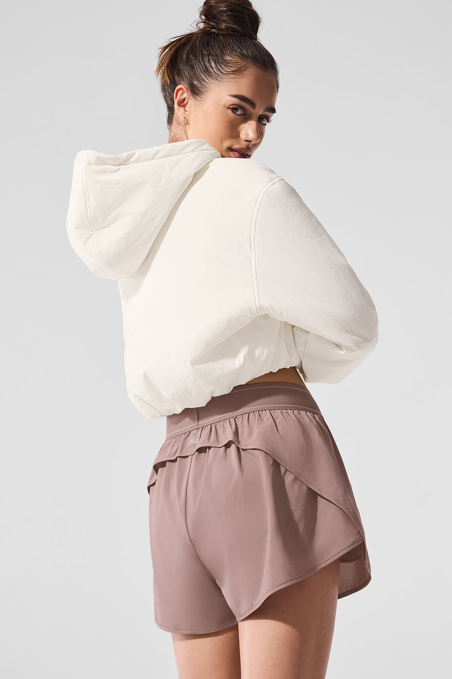Relaxed streetwear fit of cropped hoodie men style photographed in urban morning light