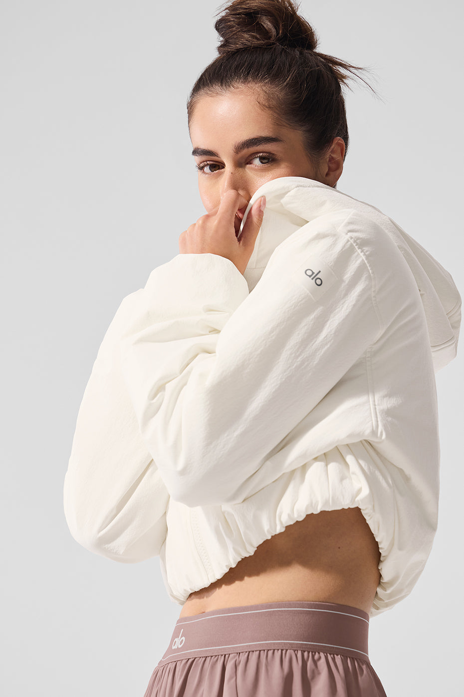 Zoomed-in detail of full-zip hoodie closure and bubbled cuff structure