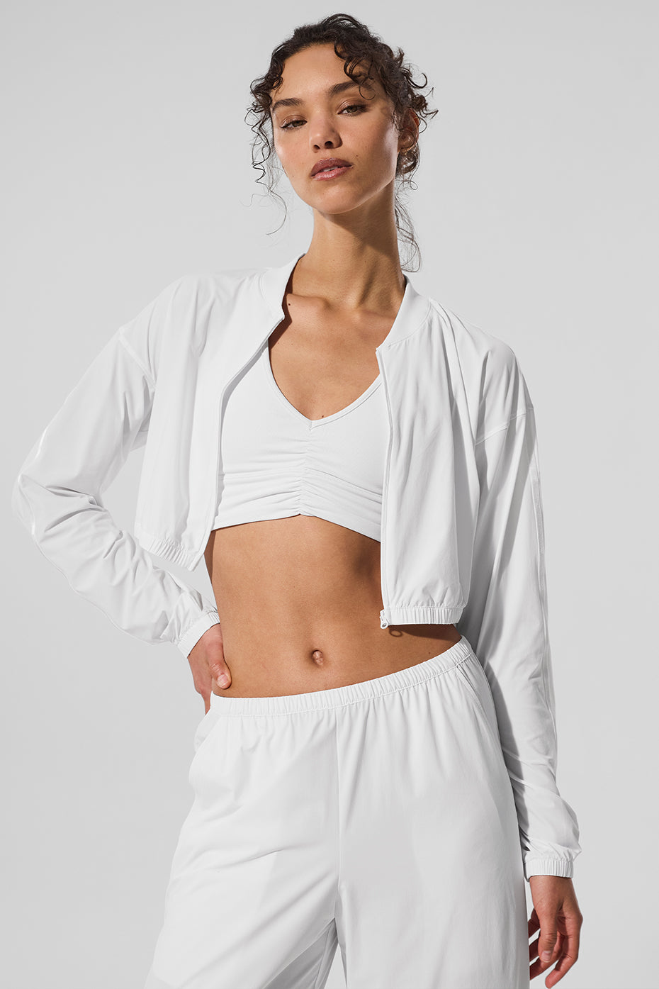 Breezy cropped zip-up jacket in white, showcasing its lightweight design.