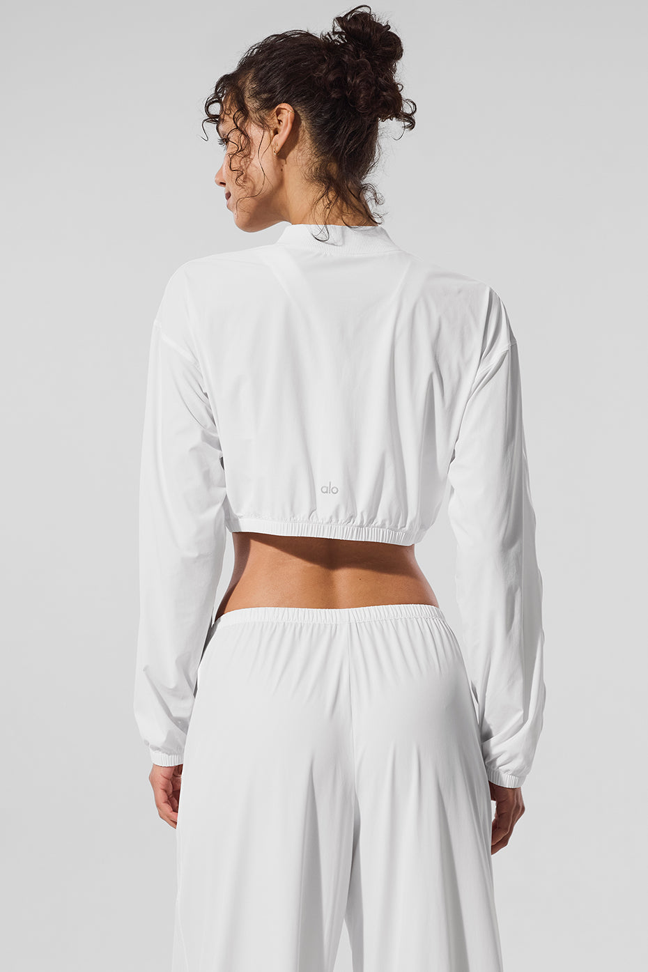 Breezy cropped zip-up jacket in white, showcasing its lightweight design.