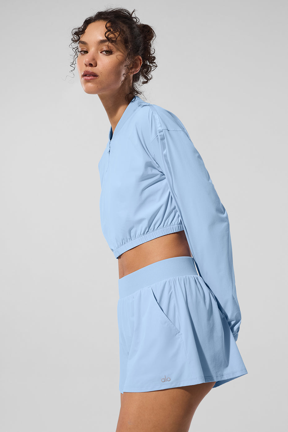 Front view of the cropped breezy full-zip jacket in seashell blue.