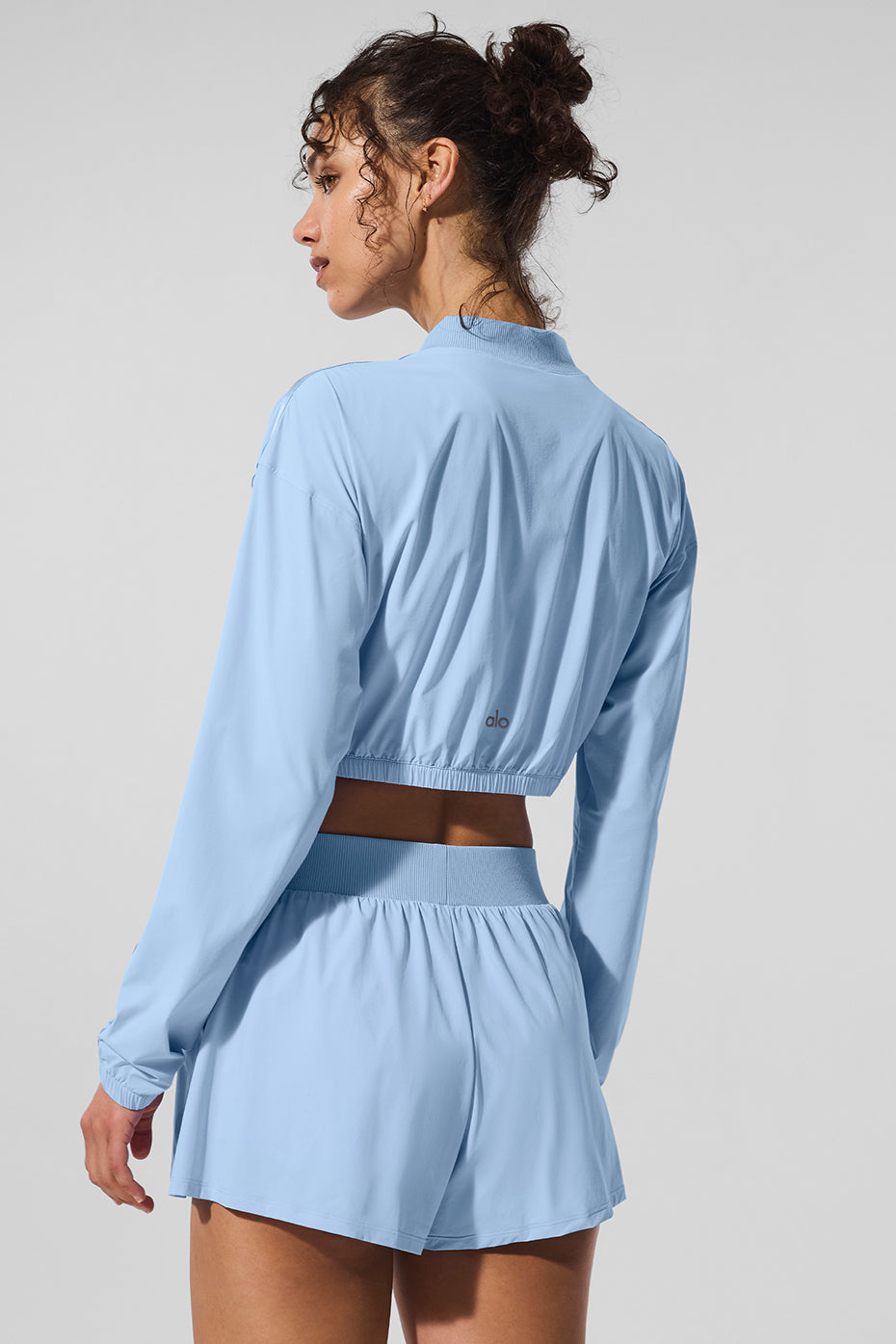 Close-up of the full zip detail on the cropped jacket.