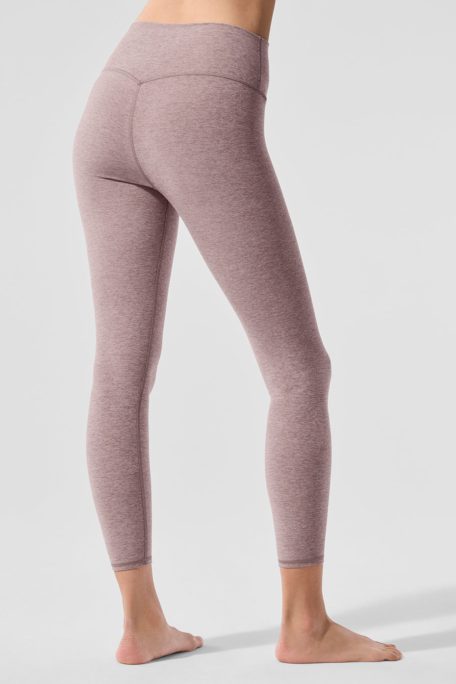 Model wearing Alo Yoga Luxe High-Waist Leggings during a yoga session