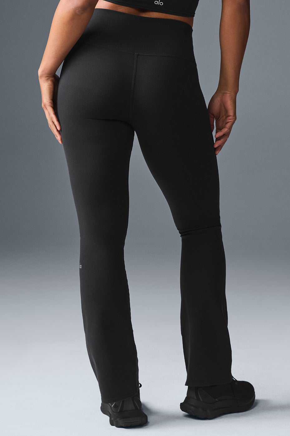 Back view highlighting the wide waistband of the leggings