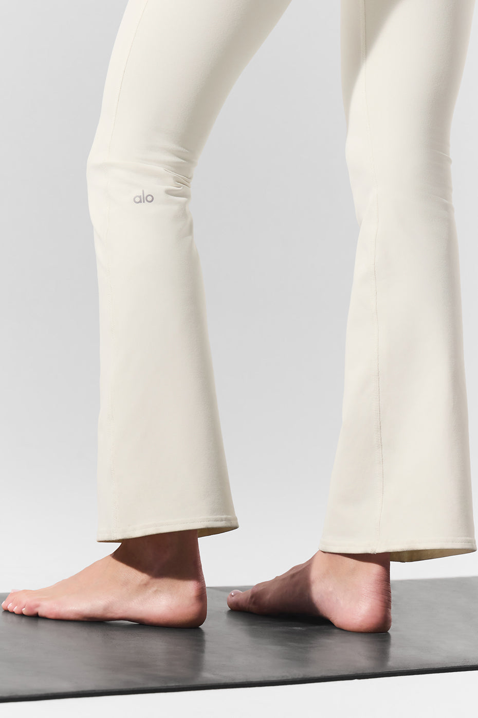Full-length view of 7/8 bootcut leggings styled with sneakers