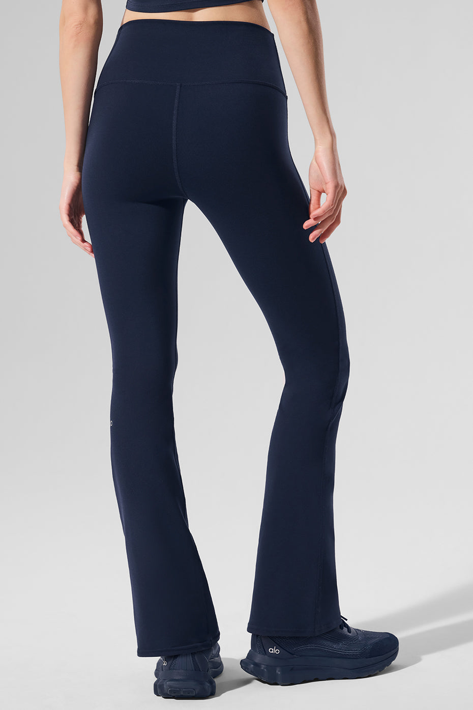 Model wearing Airbrush High-Waist Bootcut Leggings during a workout.