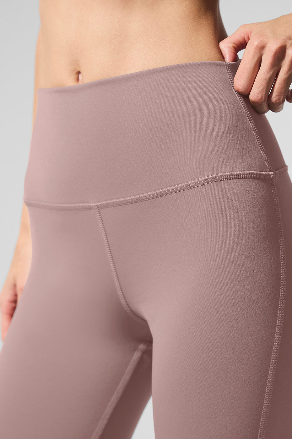 Front view of taupe high-waist bootcut leggings, showcasing the flared leg design.