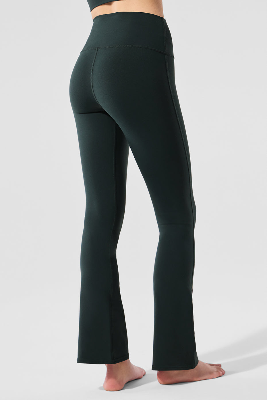 Model wearing high waist leggings with pockets, perfect for yoga or casual outings