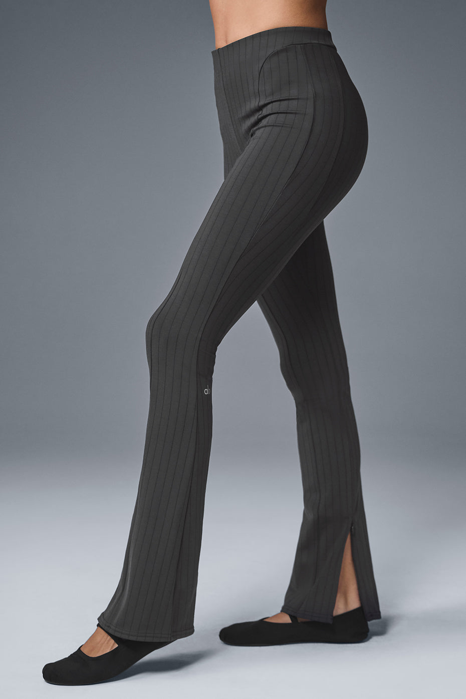 Close-up of high-waist waistband and textured pinstripe fabric detail