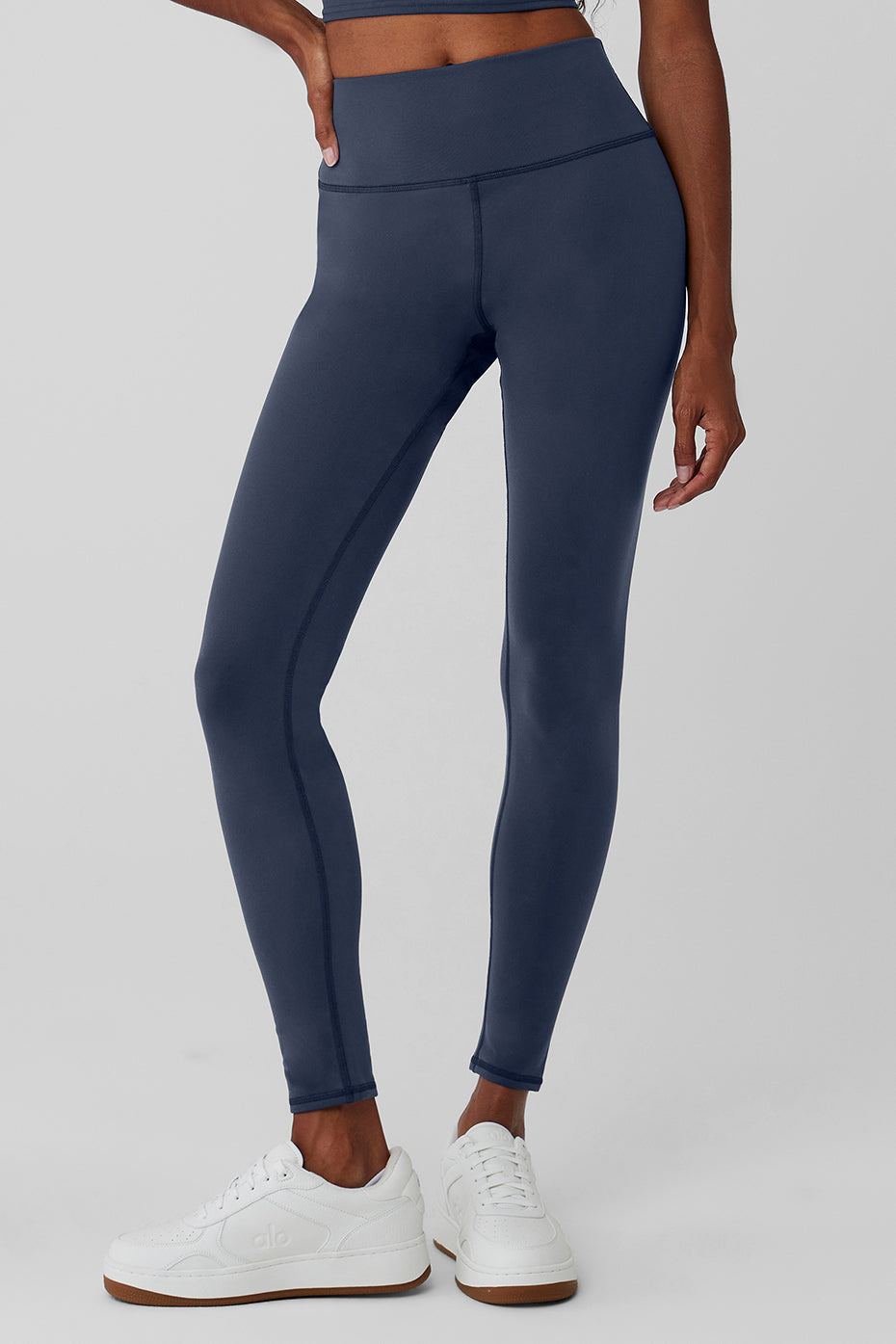 Front view of Nocturne high-waisted winter leggings in navy.