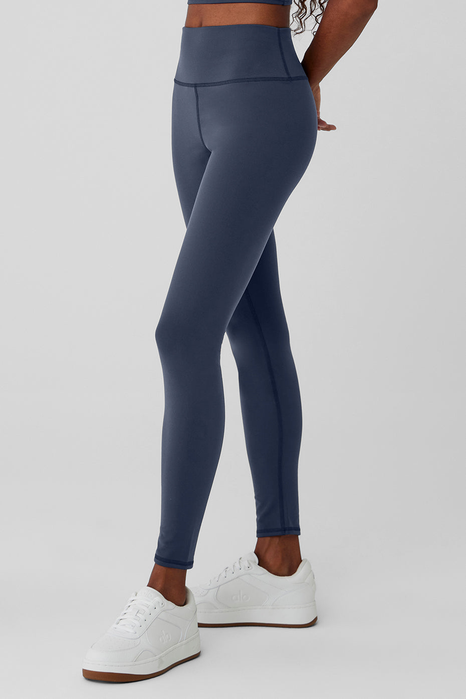 Model wearing high-waisted winter leggings during a workout.