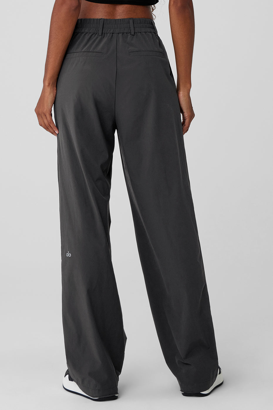 Side view showcasing the relaxed fit of the wide-leg trousers.
