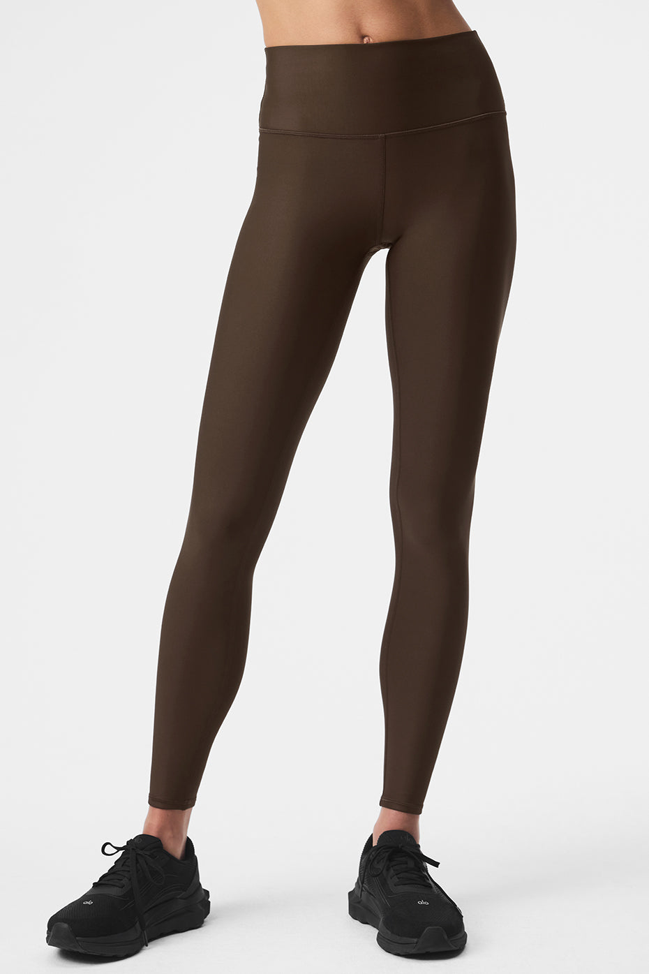 Front view of espresso high waist leggings styled for winter yoga
