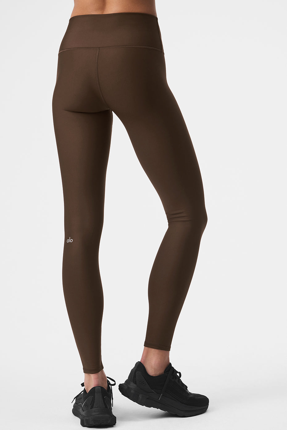 Side angle showing sculpted fit of athleta leggings in espresso tone