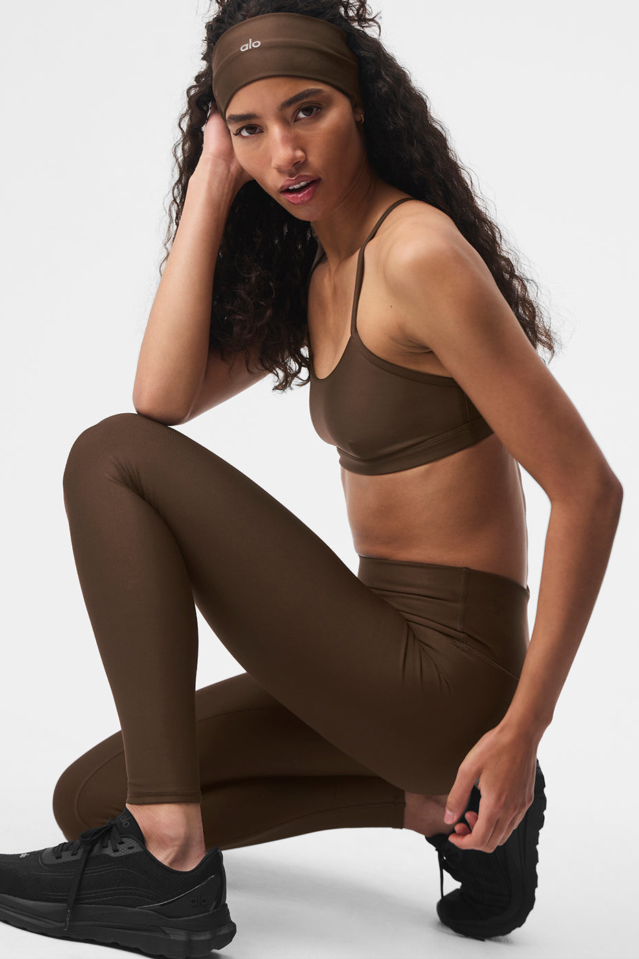 Front view of espresso high waist leggings styled for winter yoga