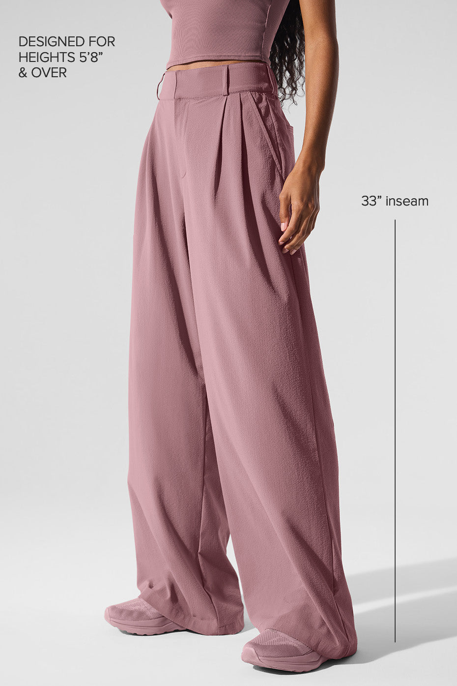 Detail shot of waistband and pleats of fashion trousers in Smoky Quartz