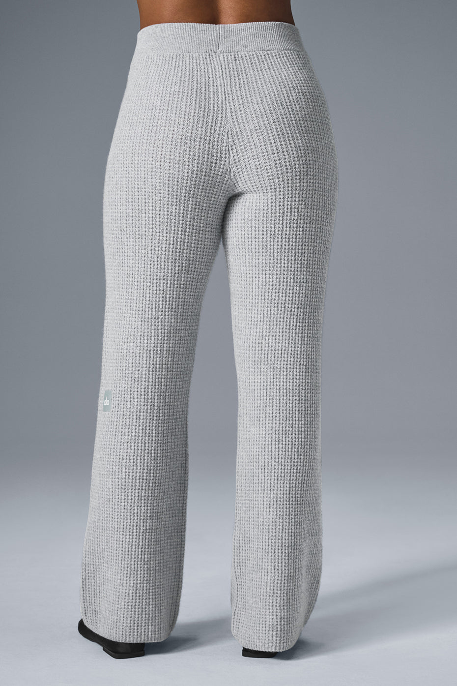 Model wearing cashmere wide leg pants paired with a cropped long sleeve.