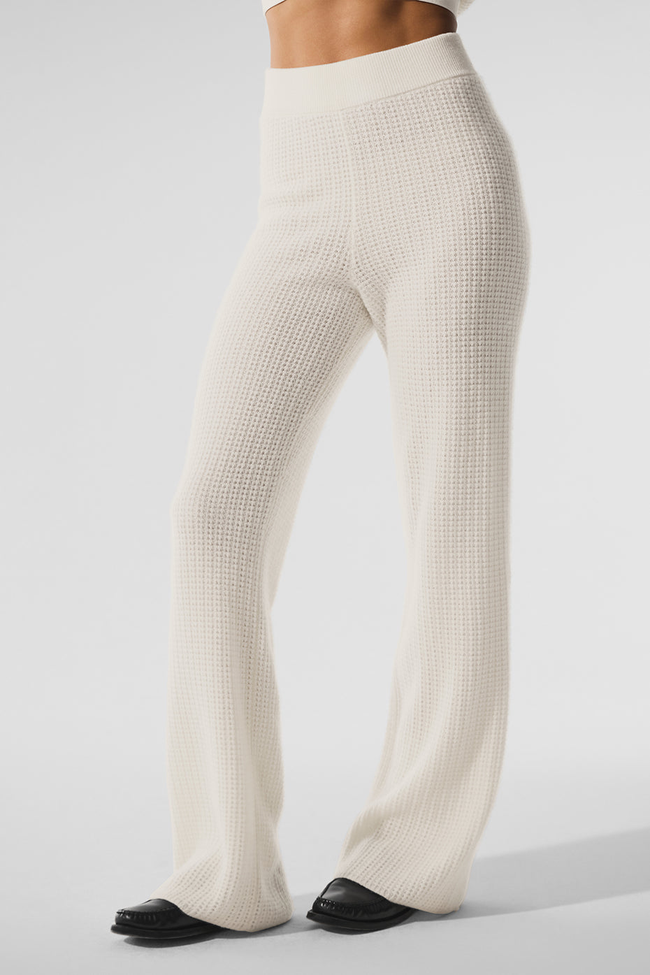Front view of ivory cashmere pants ladies love, worn with cropped sweater