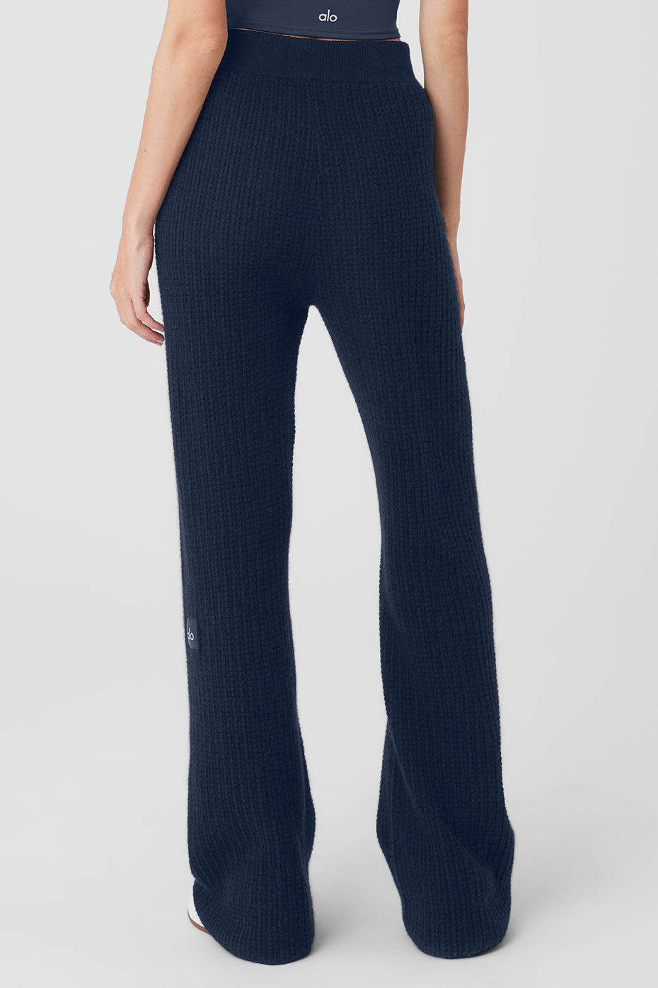 Wide leg cashmere pants styled with a cropped top for a chic look.