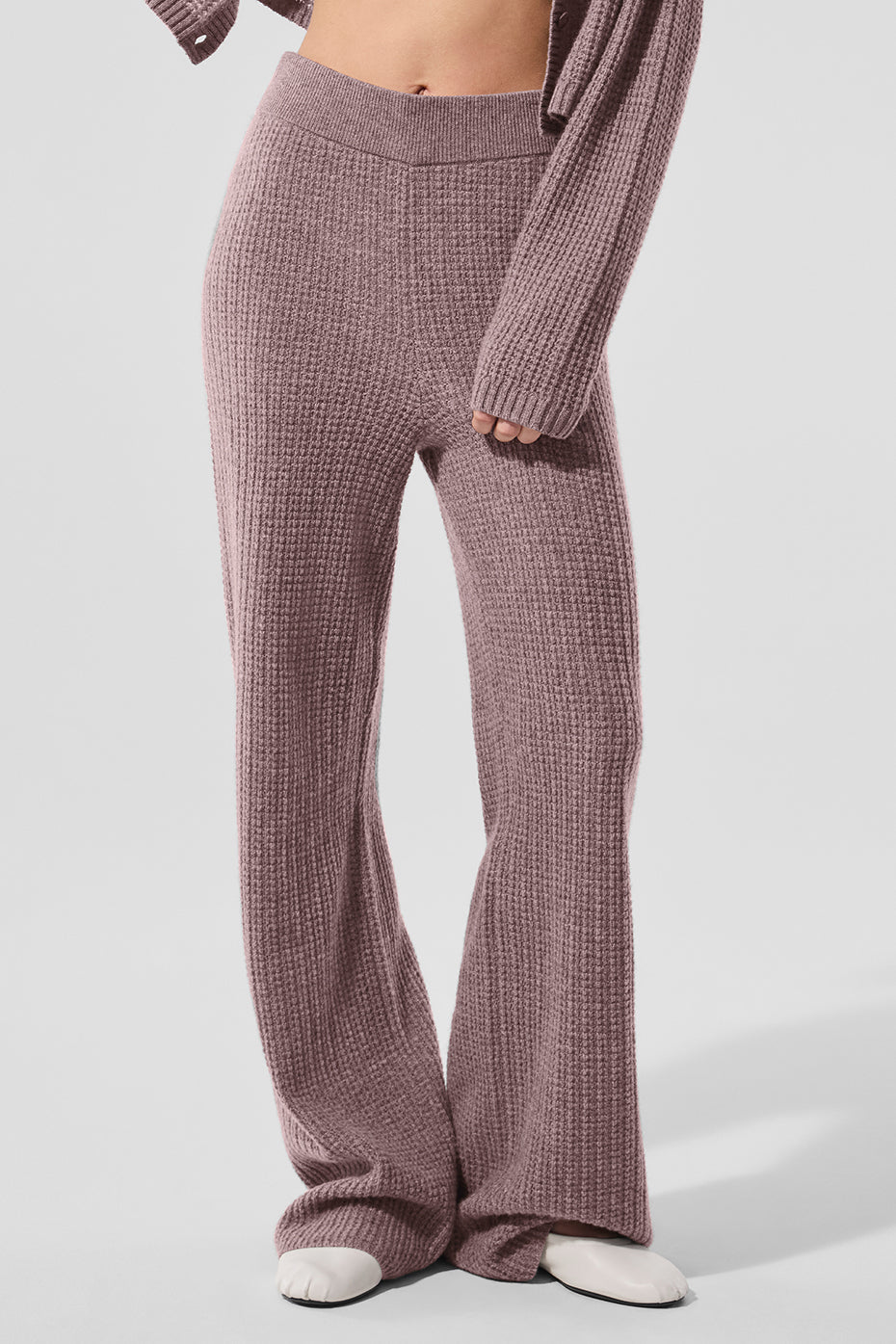 Wide-leg cashmere pants in a cozy setting, showcasing the plush texture.
